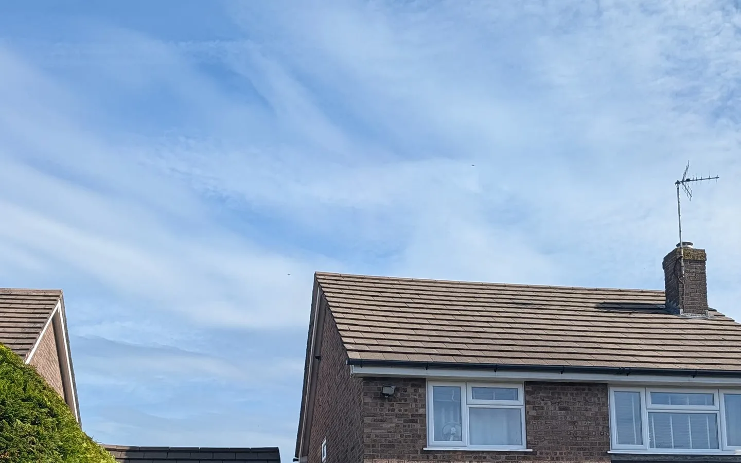 Wide street-level view of the completed roof clean in Tean.