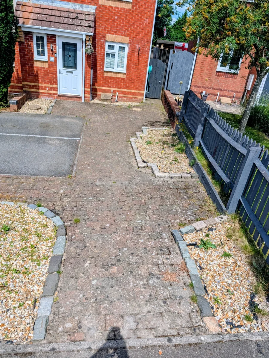 A front garden path before cleaning