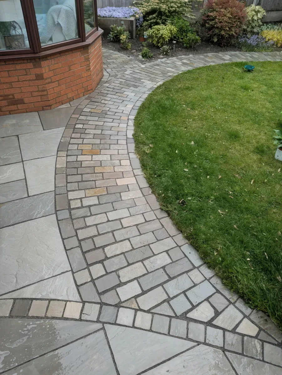 The same curved garden path after cleaning