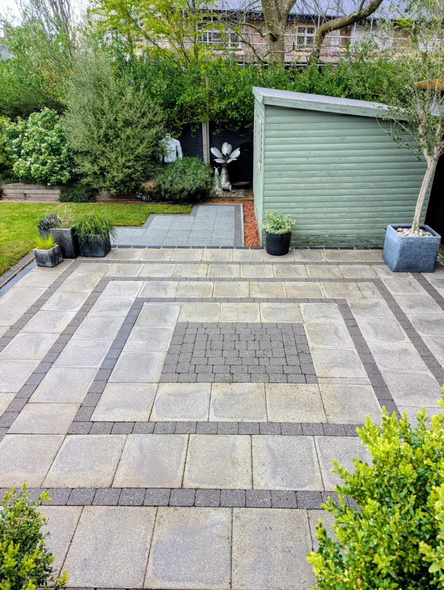 The same patterned paved patio after cleaning