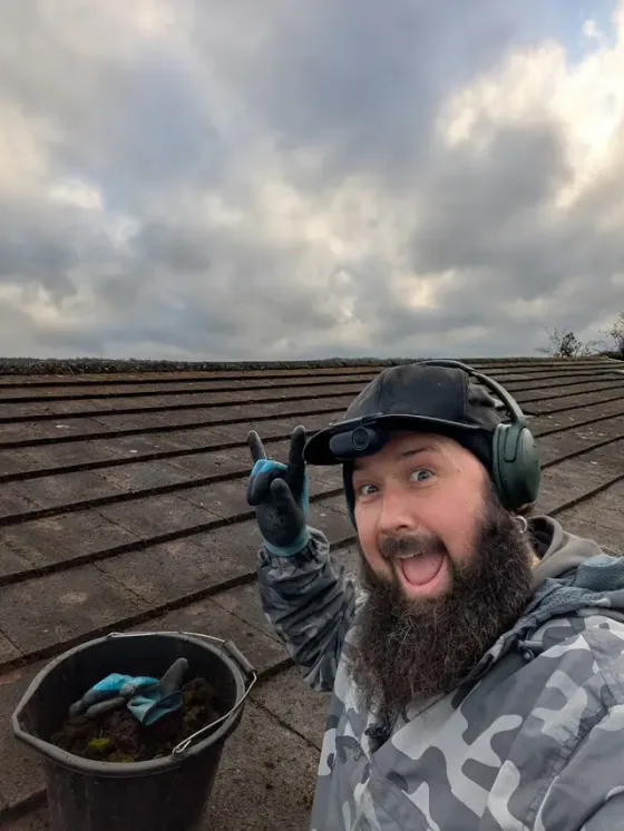 Mike working on a tiled roof during a Tidy Jet Washing project