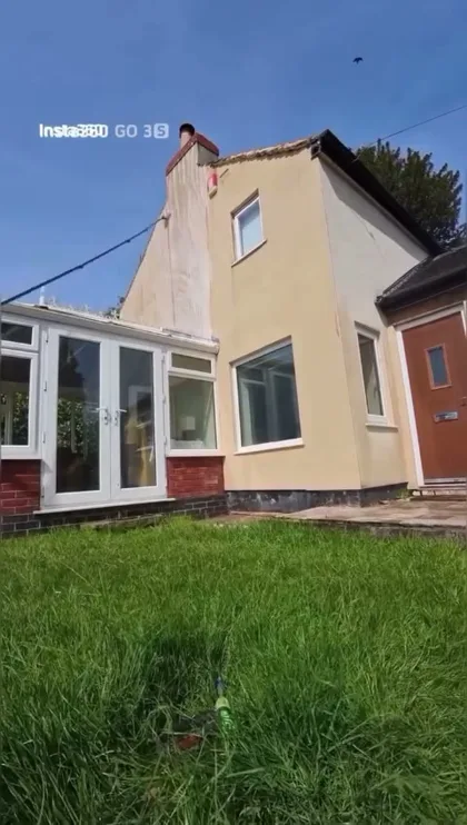 Render-cleaning progress on an exterior wall