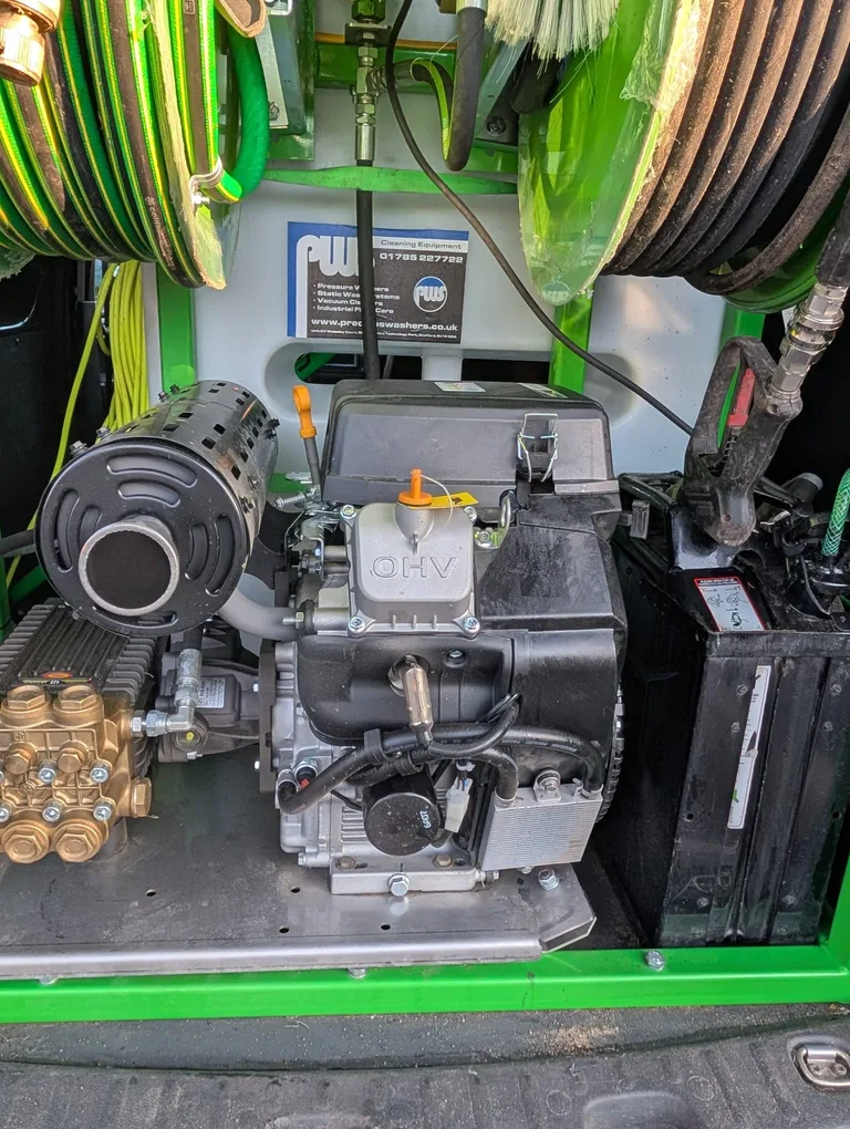 Close view of the pressure washer engine and pump fitted inside the Tidy Van.