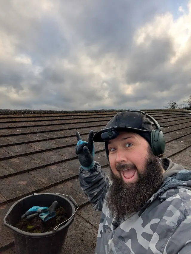 Mike working on a tiled roof during a Tidy Jet Washing project.